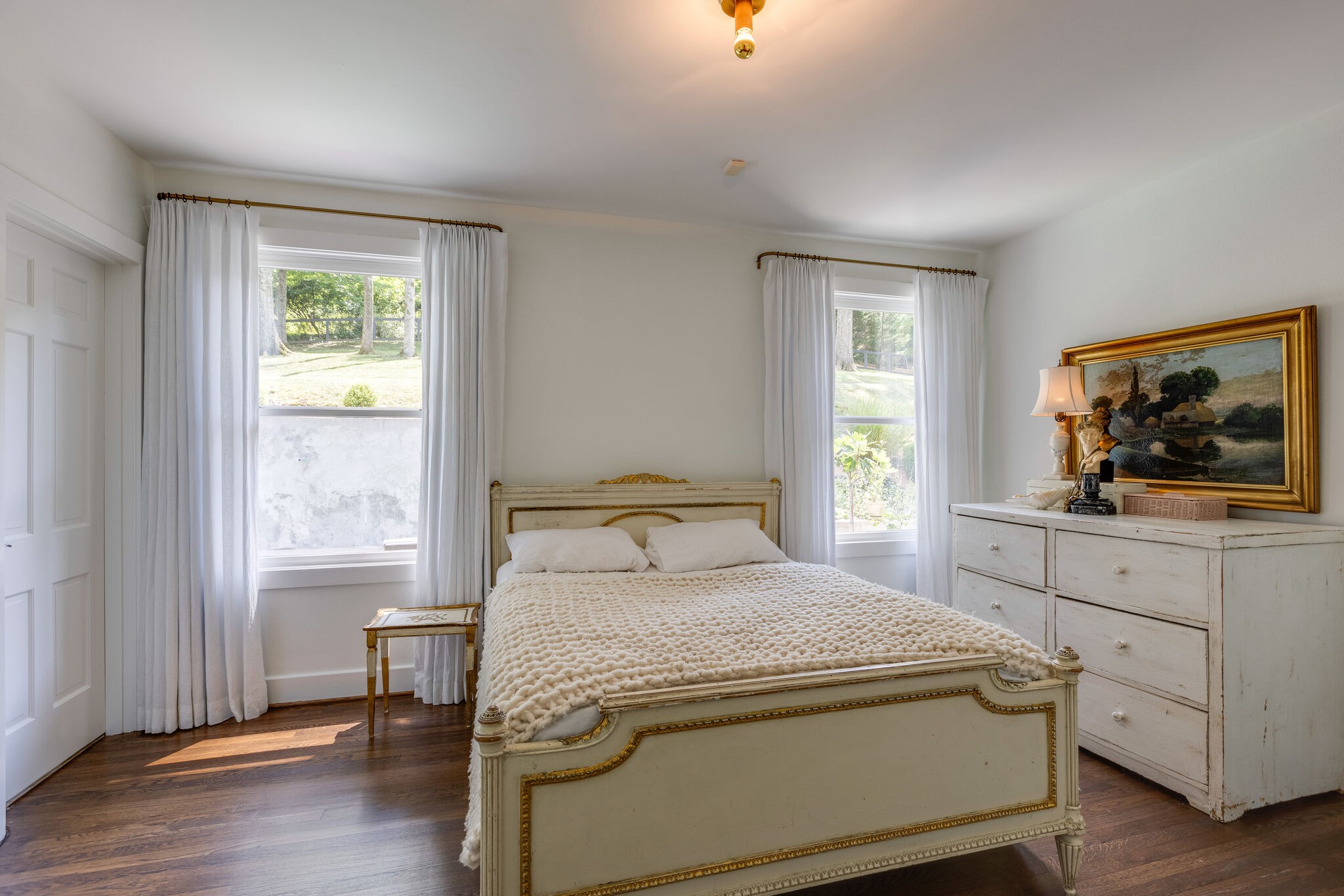 915 Overton Lea Road Nashville, TN 37220 - Photo 23 of 47 a bedroom with a bed and a flat screen tv