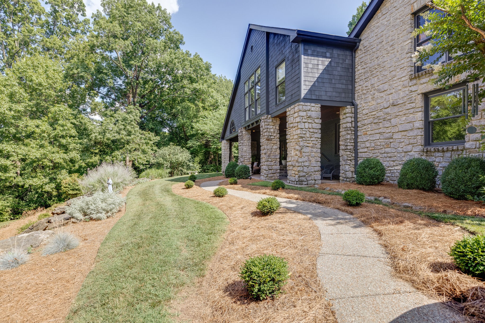 915 Overton Lea Road Nashville, TN 37220 - Photo 4 of 47 a front view of a house with a yard