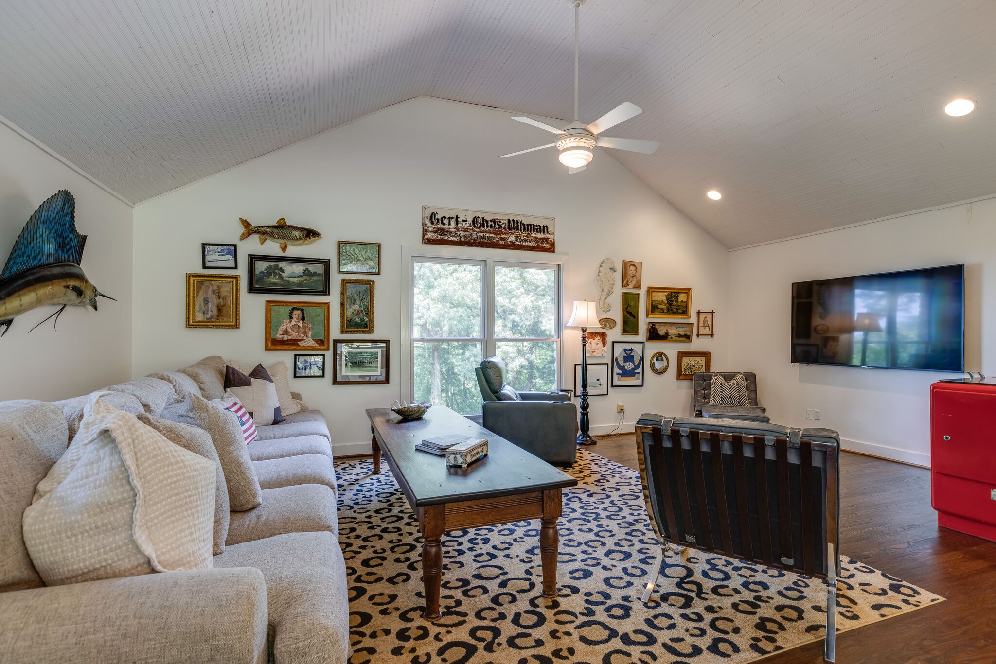 915 Overton Lea Road Nashville, TN 37220 - Photo 34 of 47 a living room with furniture and a flat screen tv