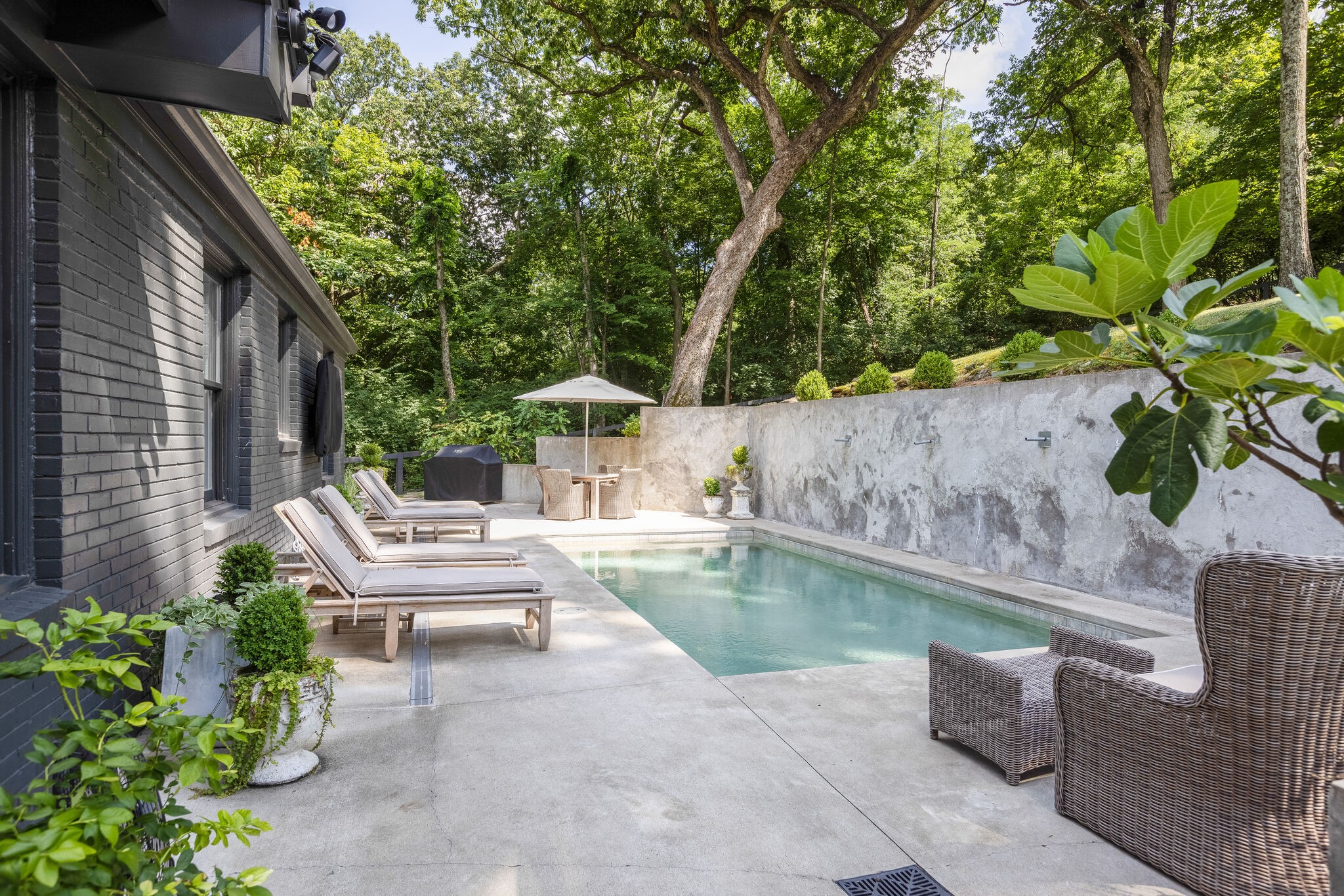 915 Overton Lea Road Nashville, TN 37220 - Photo 37 of 47 a view of backyard with swimming pool and outdoor seating