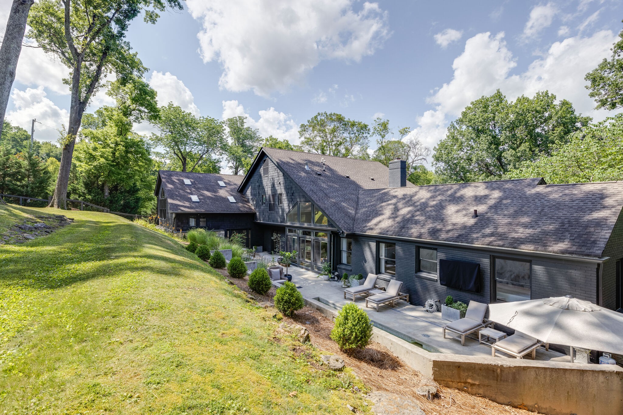 915 Overton Lea Road Nashville, TN 37220 - Photo 39 of 47 a view of house with backyard outdoor seating and green space