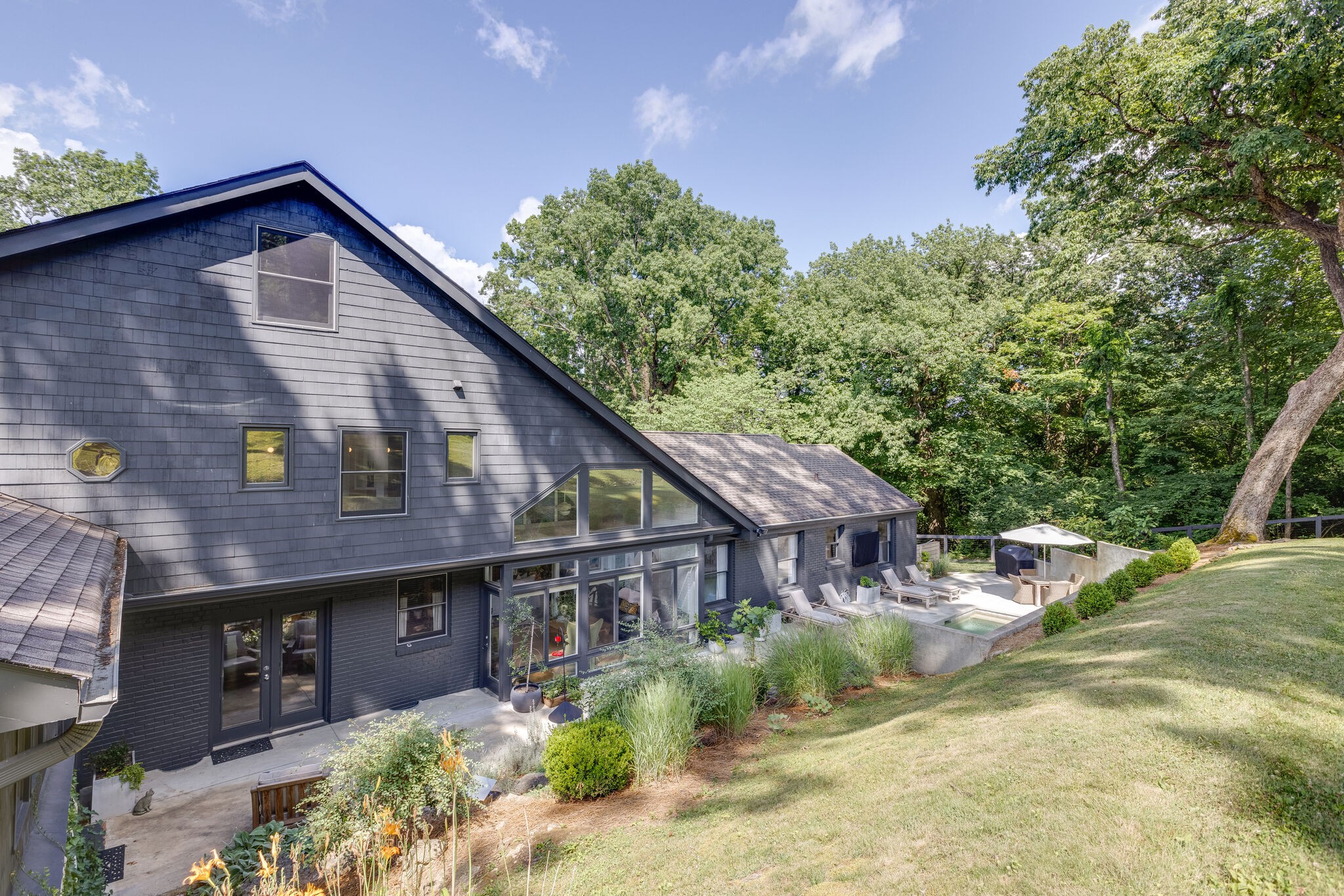 915 Overton Lea Road Nashville, TN 37220 - Photo 40 of 47 a view of a house with a small yard and plants
