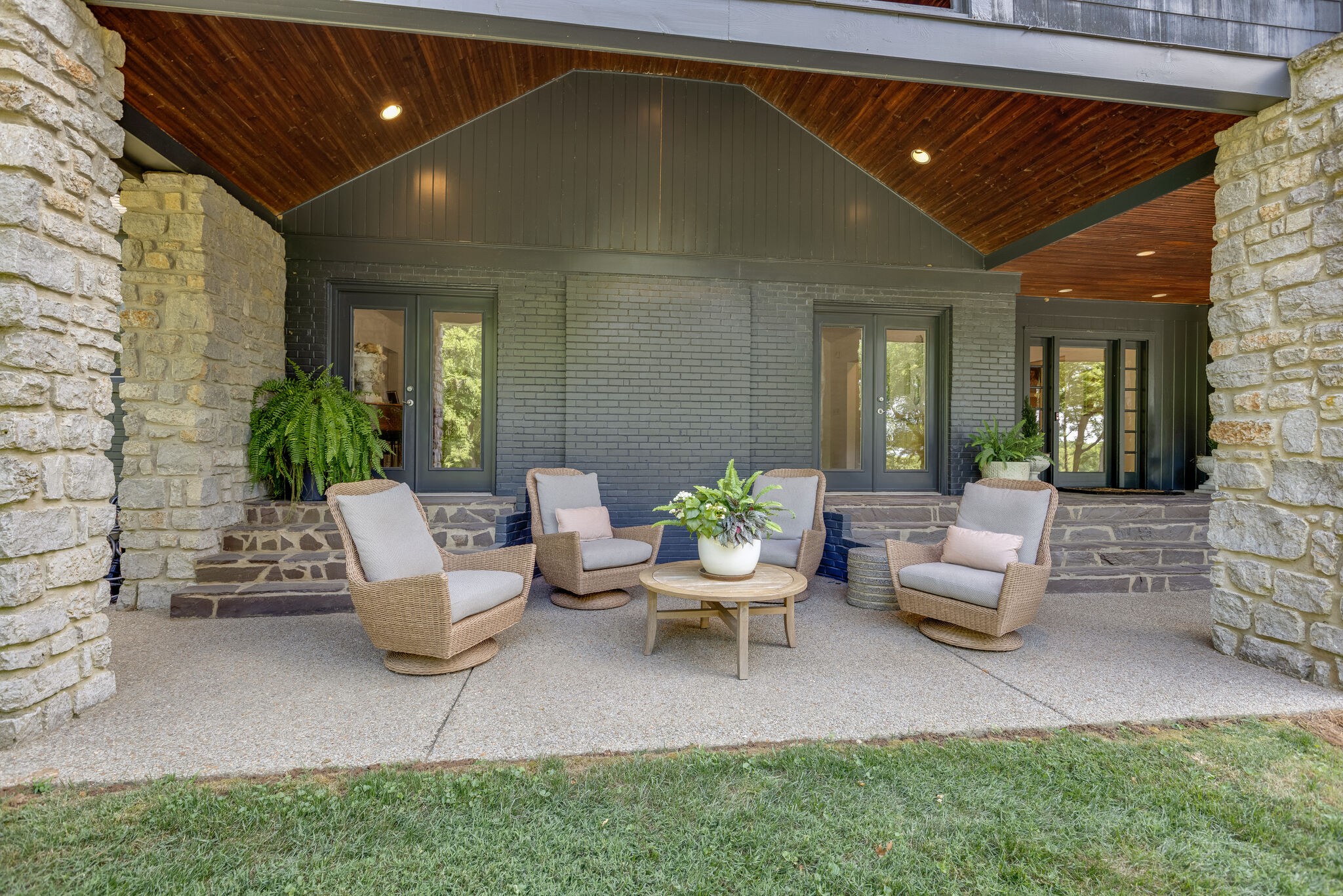 915 Overton Lea Road Nashville, TN 37220 - Photo 5 of 47 a outdoor space with couches and potted plant