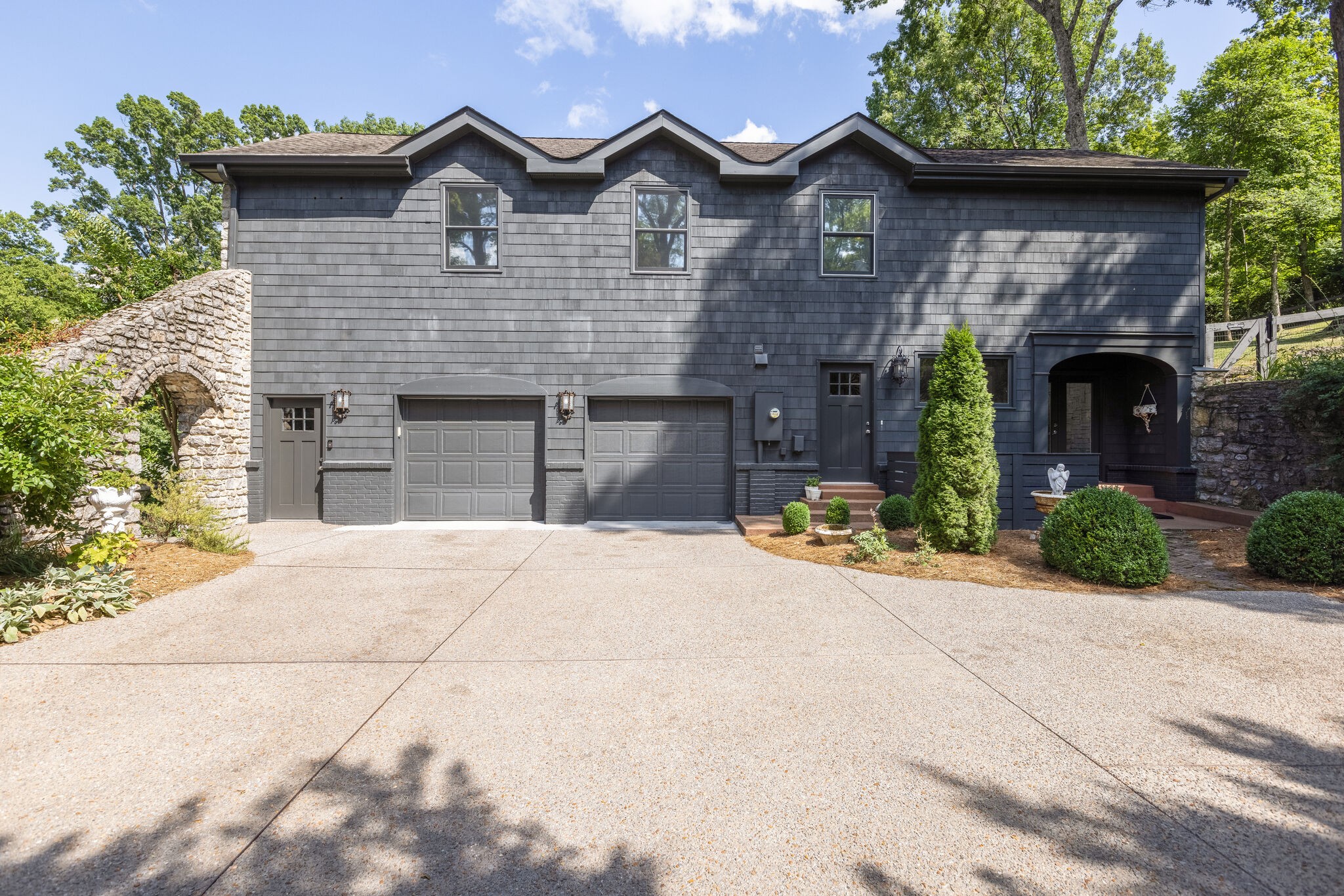915 Overton Lea Road Nashville, TN 37220 - Photo 41 of 47 a front view of a house with a garden