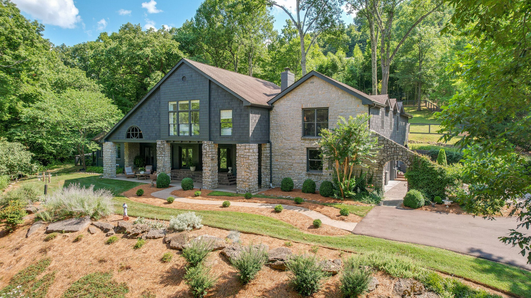 915 Overton Lea Road Nashville, TN 37220 - Photo 43 of 47 a front view of house with yard and trees in the background