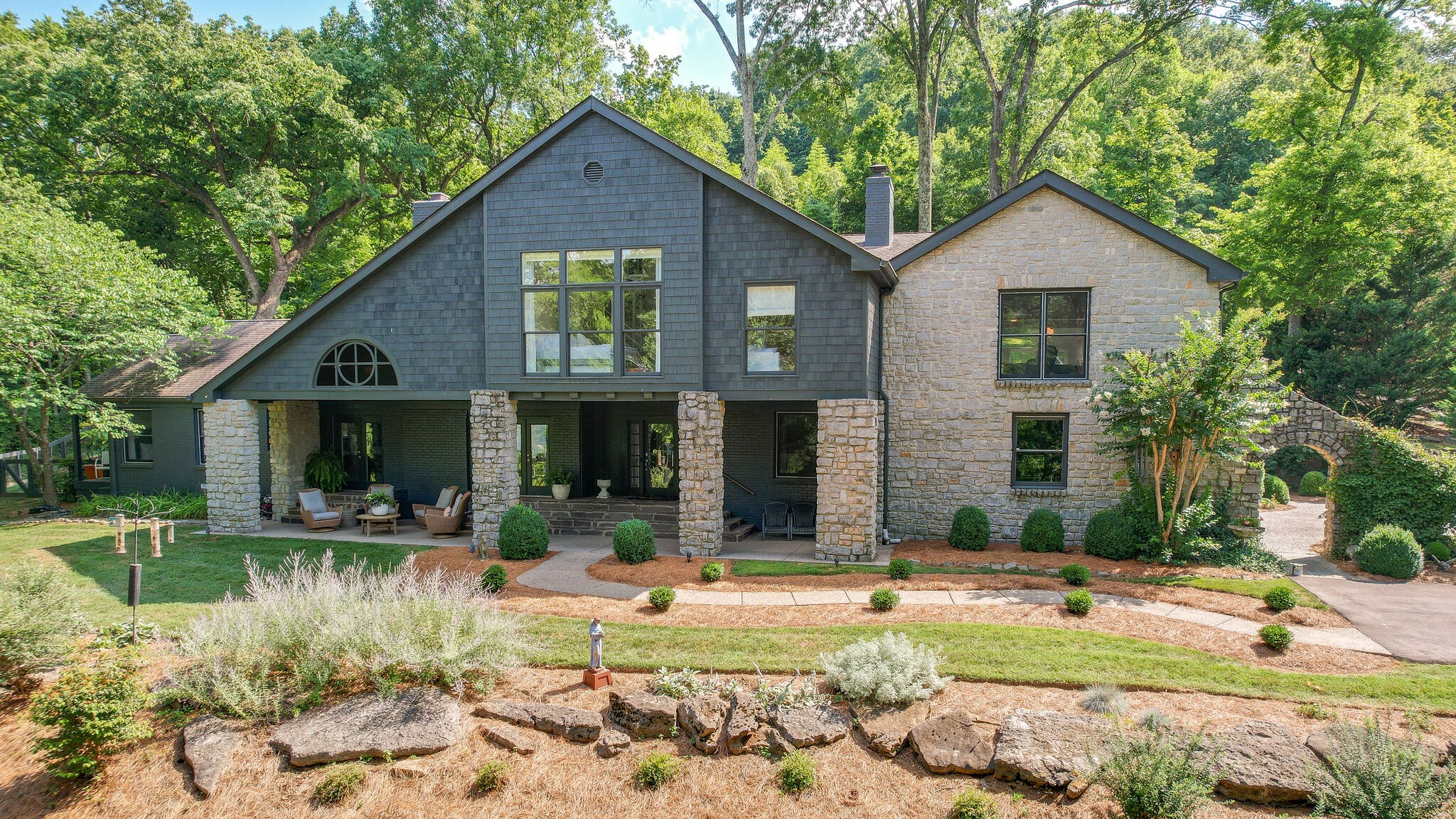 915 Overton Lea Road Nashville, TN 37220 - Photo 44 of 47 a front view of a house with garden