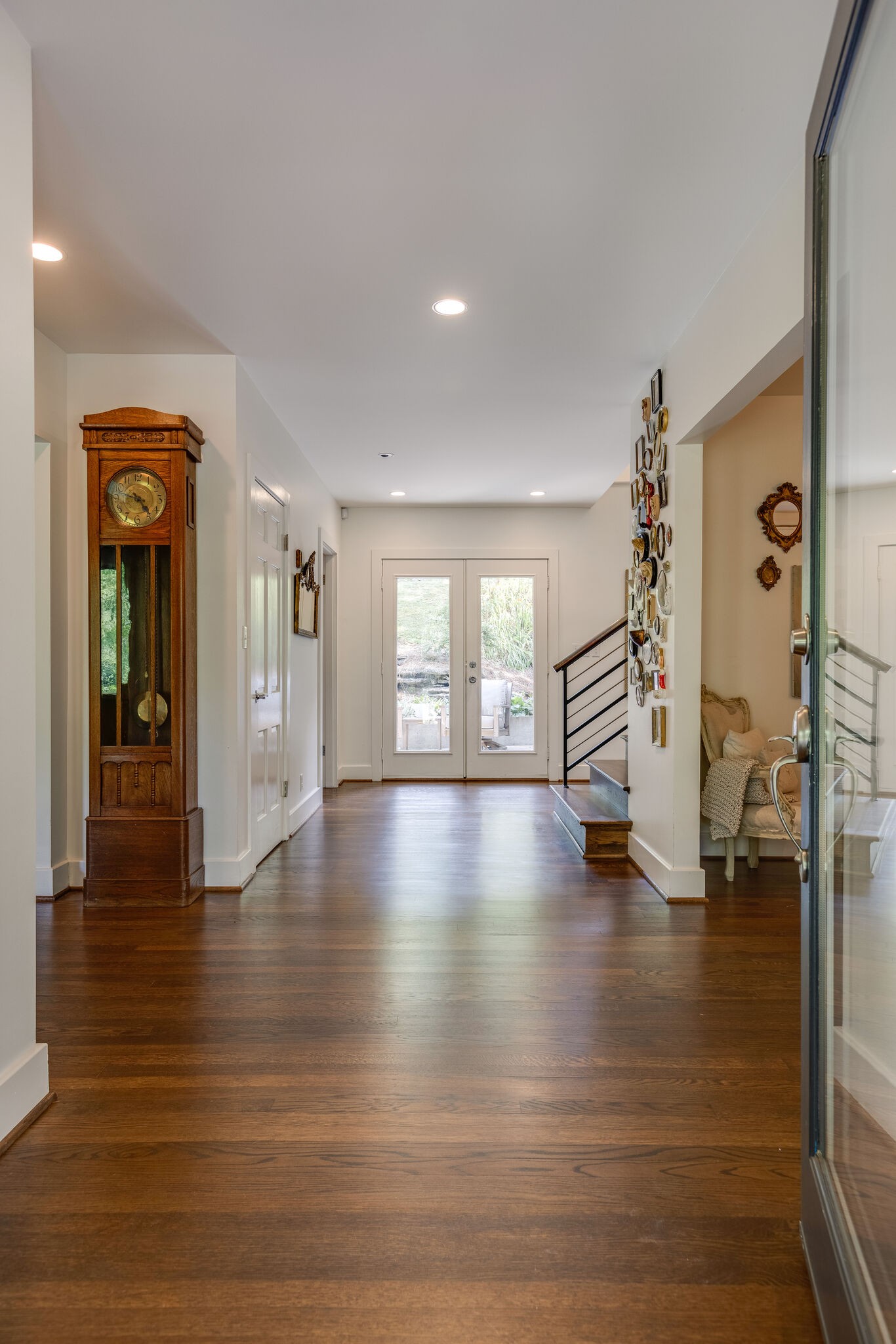 915 Overton Lea Road Nashville, TN 37220 - Photo 7 of 47 a view of an entryway with wooden floor and a living room