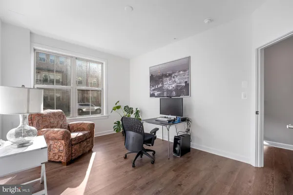 a work room with furniture and windows