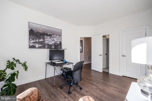 a workspace with furniture and wooden floor