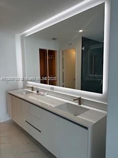 700 Northeast 24th Street, Unit 2206 Miami, FL 33137 - Photo 27 of 41 a bathroom with a sink and a mirror