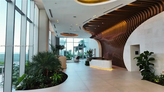a view of potted plants in backyard of a building