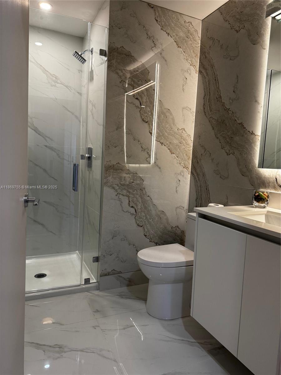 700 Northeast 24th Street, Unit 2206 Miami, FL 33137 - Photo 38 of 41 a bathroom with a toilet and a shower