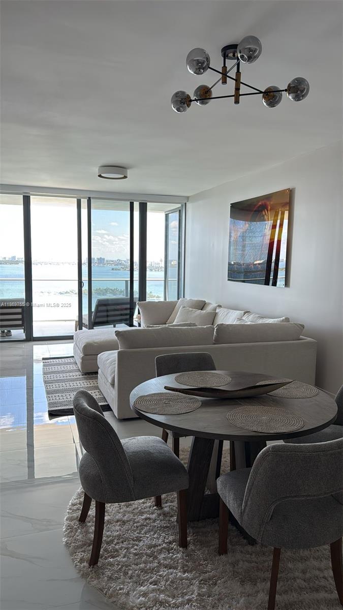 700 Northeast 24th Street, Unit 2206 Miami, FL 33137 - Photo 41 of 41 a living room with furniture and a large window