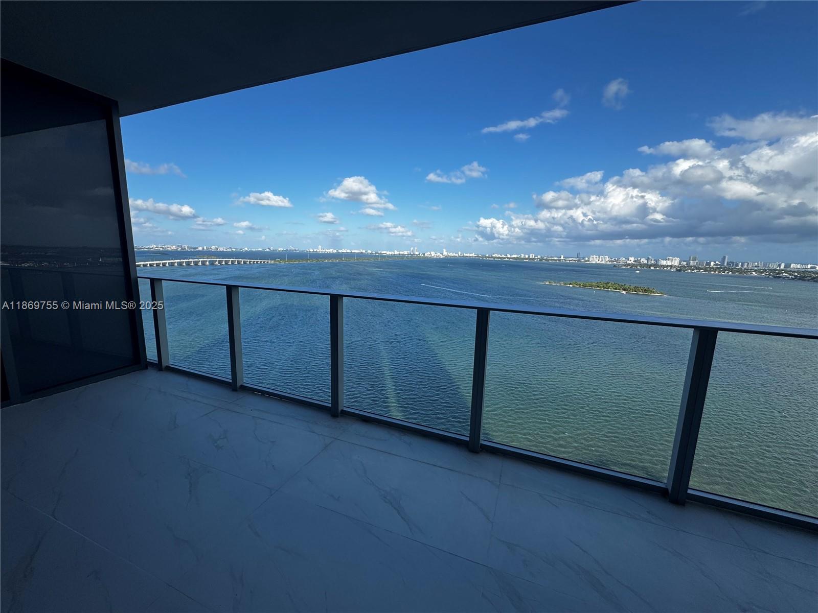 700 Northeast 24th Street, Unit 2206 Miami, FL 33137 - Photo 5 of 41 a view of a livingroom with furniture and chandelier