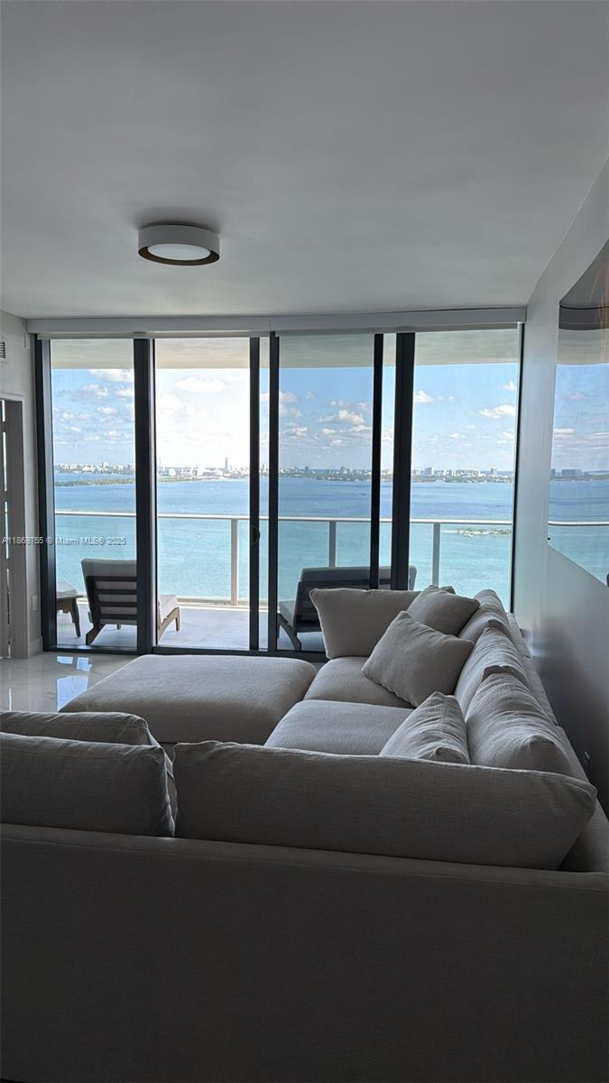 700 Northeast 24th Street, Unit 2206 Miami, FL 33137 - Photo 9 of 41 a living room with furniture and a large window