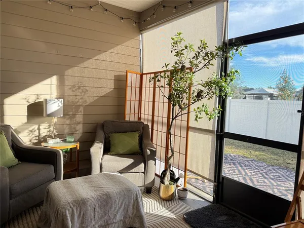 a balcony with table and chairs