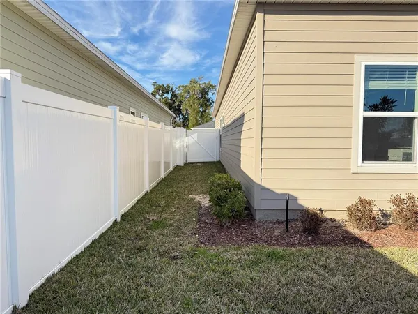 a view of a backyard with pathway