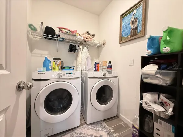 a view of a storage & utility room with a washer and dryer
