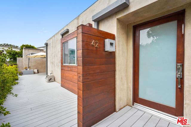 a view of a brick house with a large door