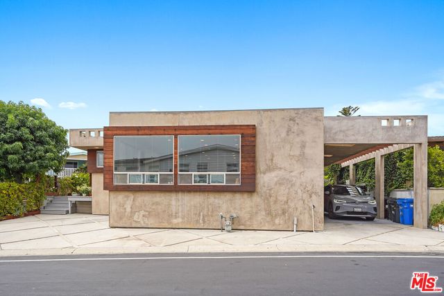 a view of building with car parked