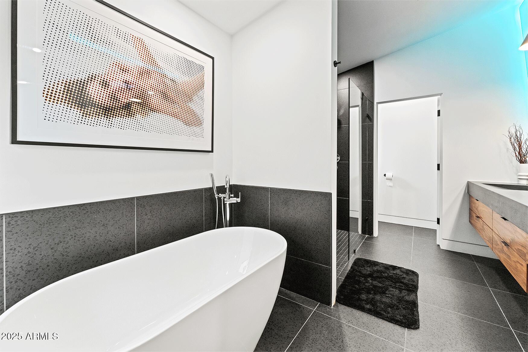 4334 East Lewis Avenue Phoenix, AZ 85008 - Photo 13 of 26 a bathroom with a bathtub and a shower