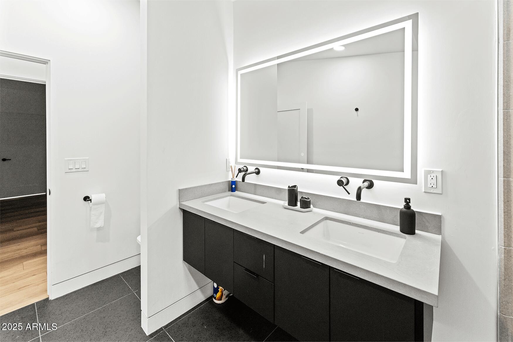 4334 East Lewis Avenue Phoenix, AZ 85008 - Photo 18 of 26 a bathroom with a sink and a mirror