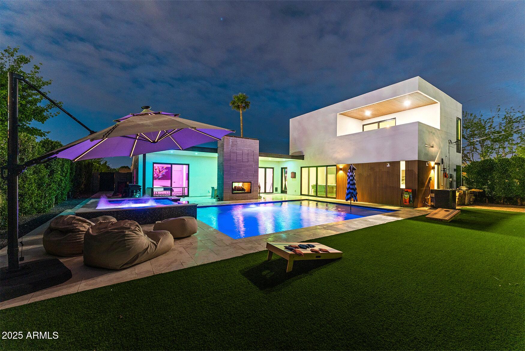 4334 East Lewis Avenue Phoenix, AZ 85008 - Photo 2 of 26 a view of pool with lawn chairs and couches