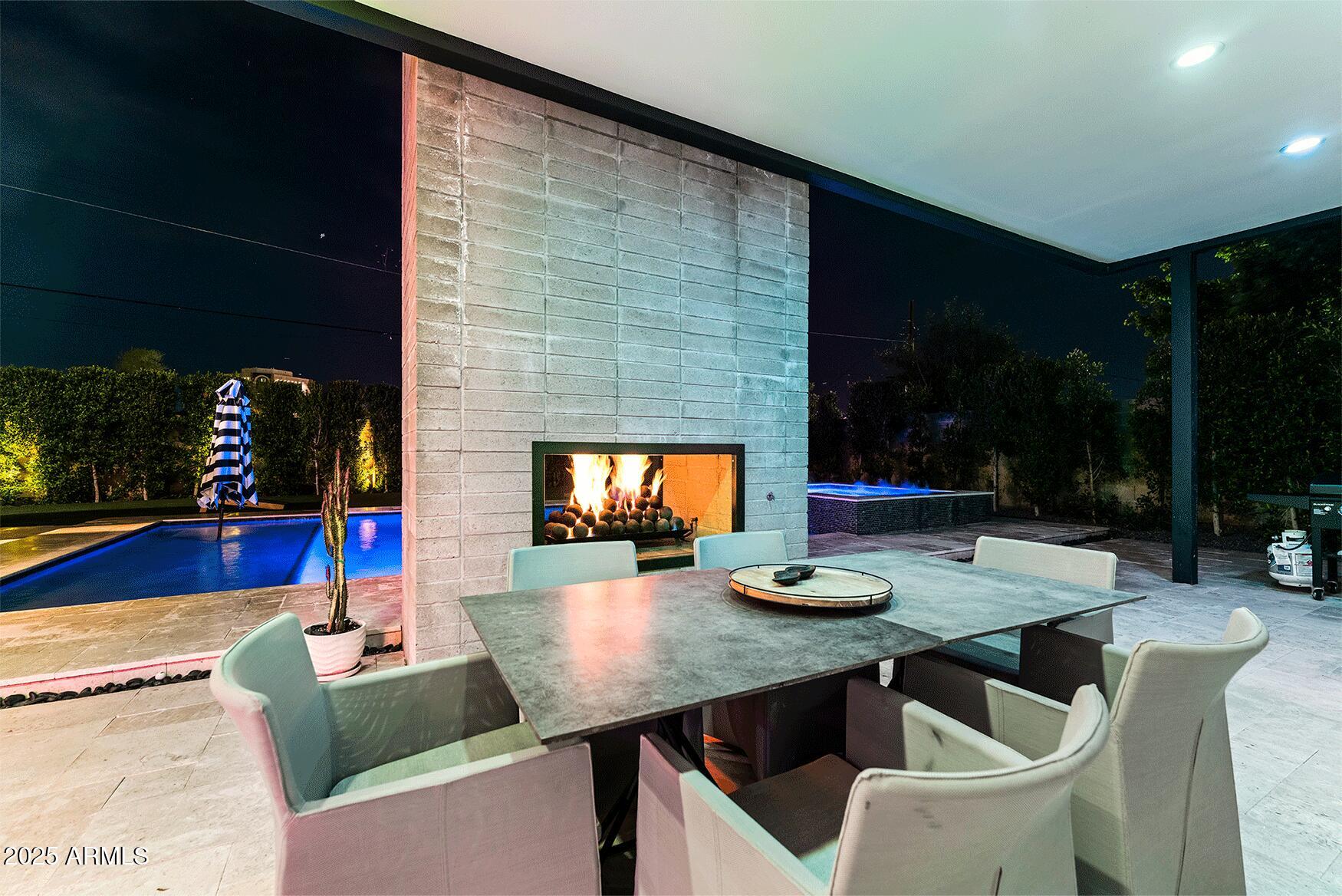 4334 East Lewis Avenue Phoenix, AZ 85008 - Photo 22 of 26 a view of outdoor dining space with a table and chairs