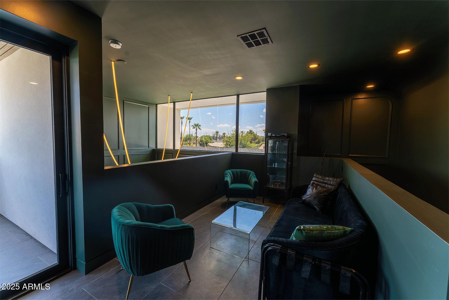4334 East Lewis Avenue Phoenix, AZ 85008 - Photo 24 of 26 a living room with furniture rug and wall painting