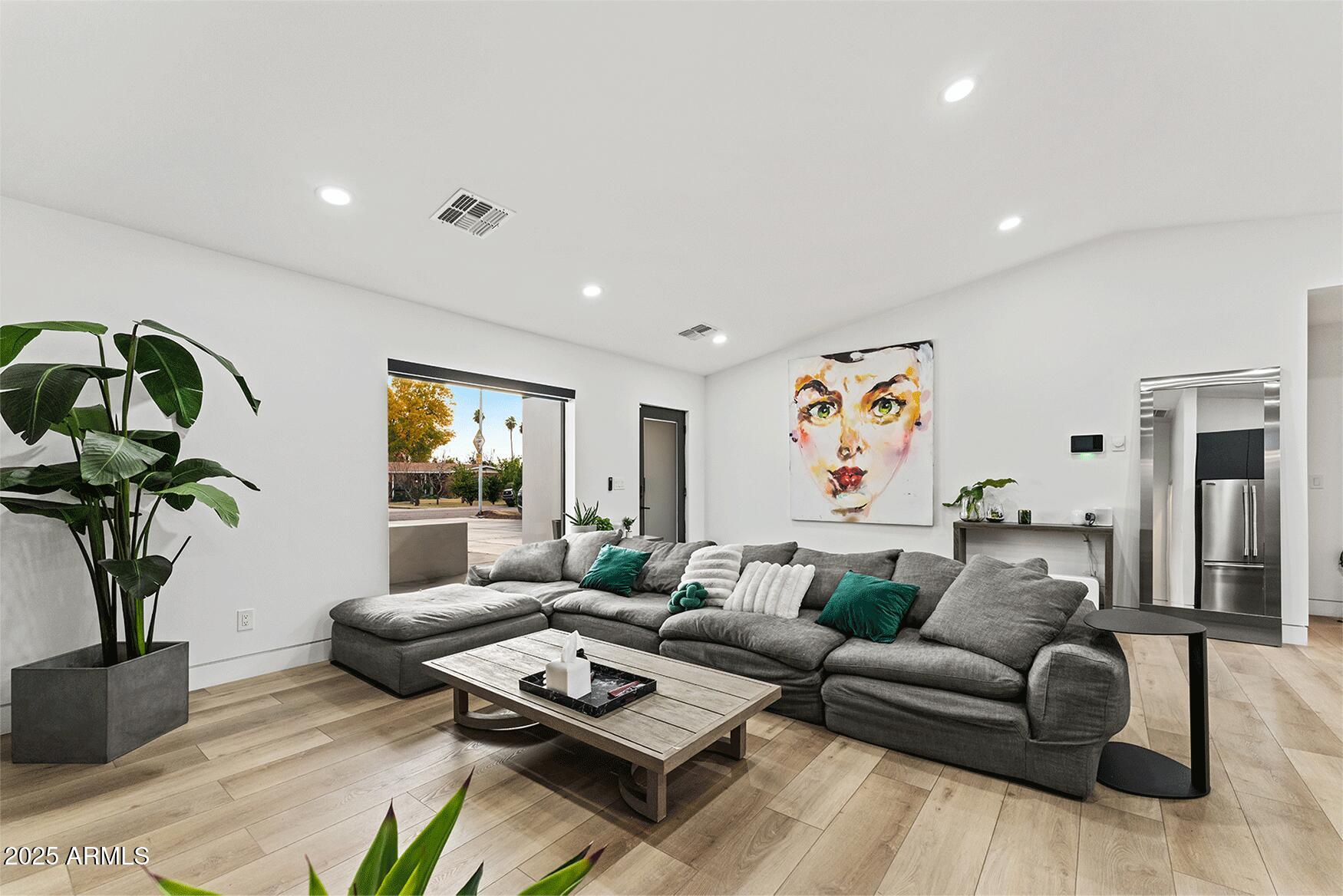 4334 East Lewis Avenue Phoenix, AZ 85008 - Photo 3 of 26 a living room with furniture a couch and a potted plant
