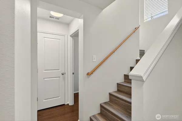 a view of entryway with wooden floor