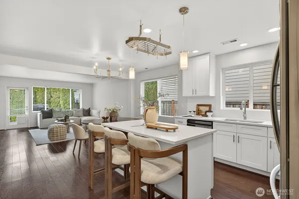 a large kitchen with a table and chairs