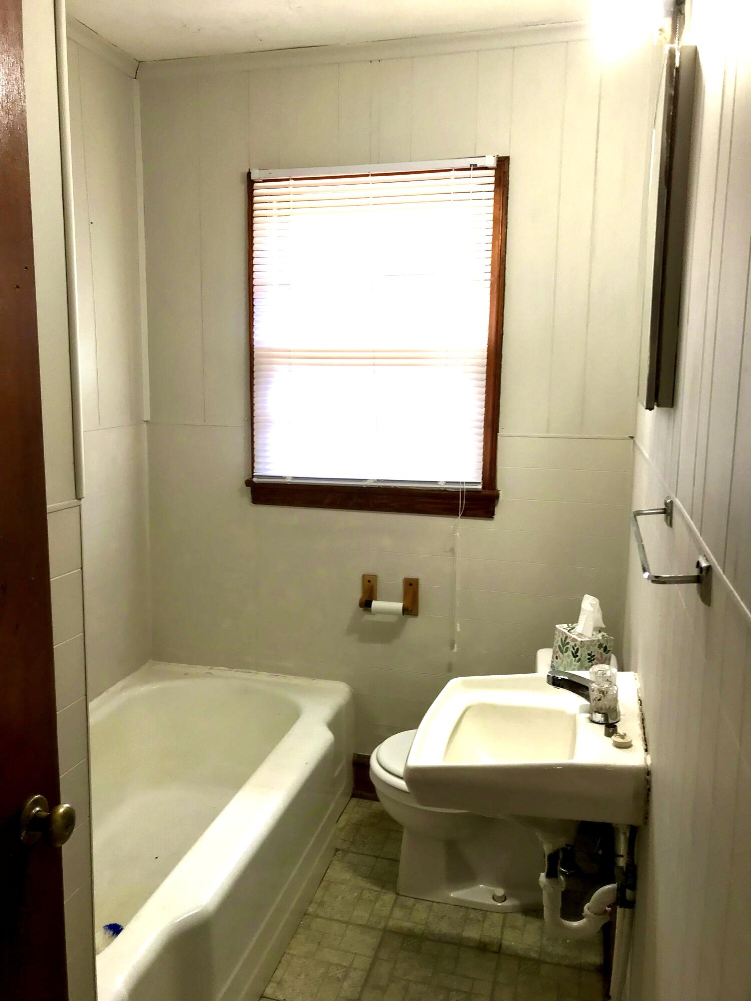 8180 Chatham Road Martinsville, VA 24112 - Photo 12 of 22 a bathroom with a sink a toilet and bathtub