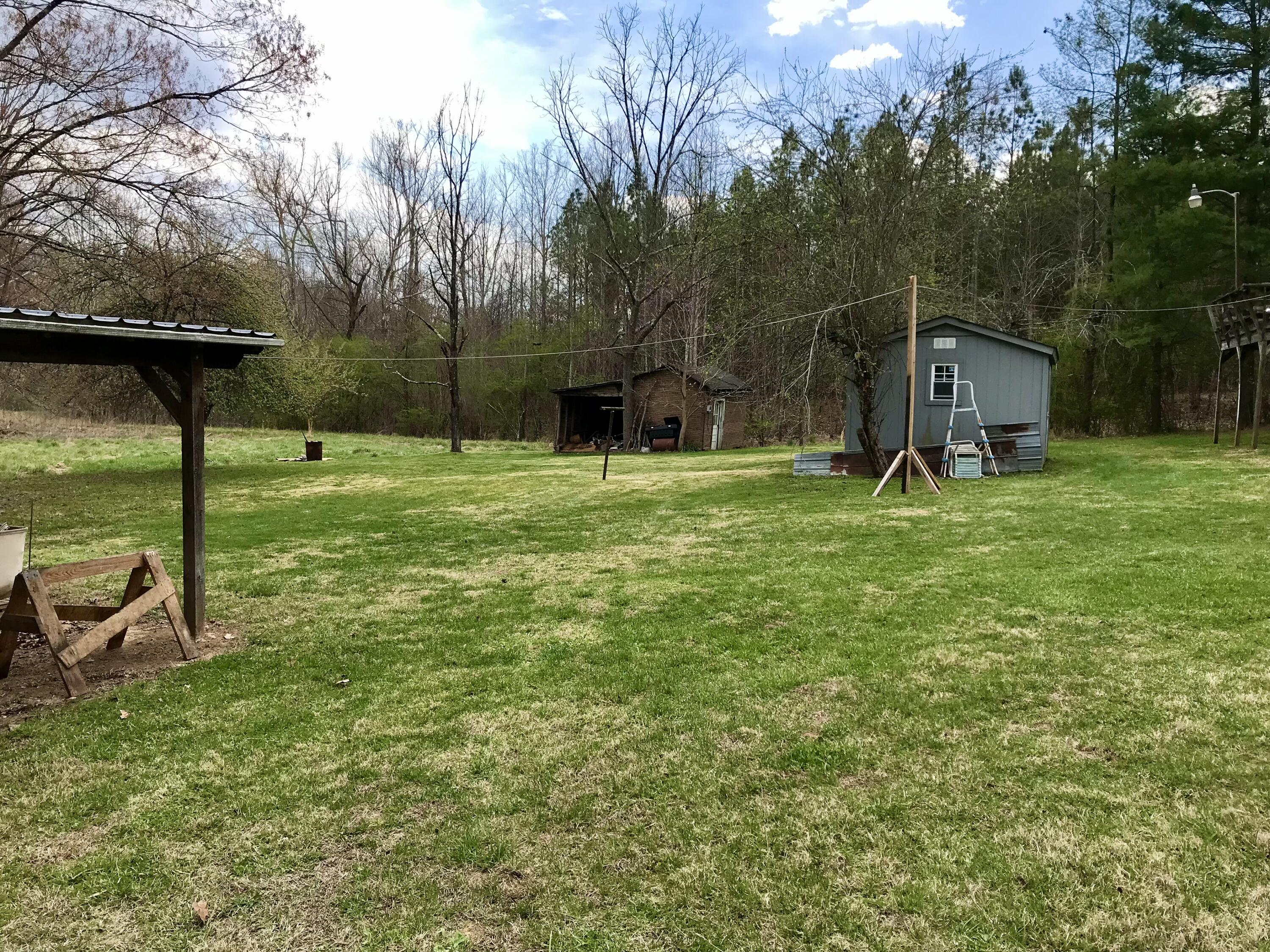 8180 Chatham Road Martinsville, VA 24112 - Photo 19 of 22 a big yard with flowing stream of water in middle