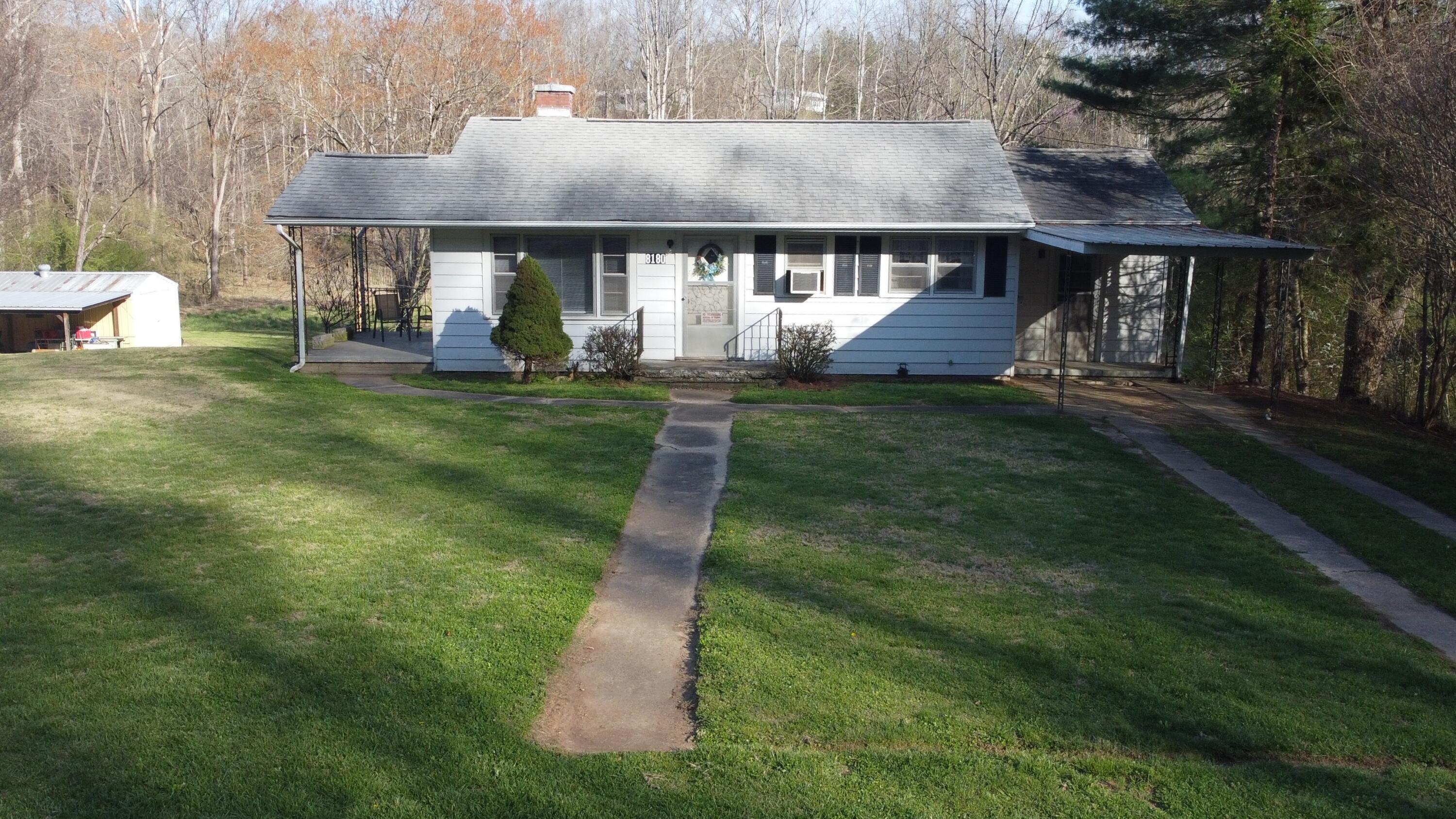 8180 Chatham Road Martinsville, VA 24112 - Photo 21 of 22 a front view of house with a garden and patio