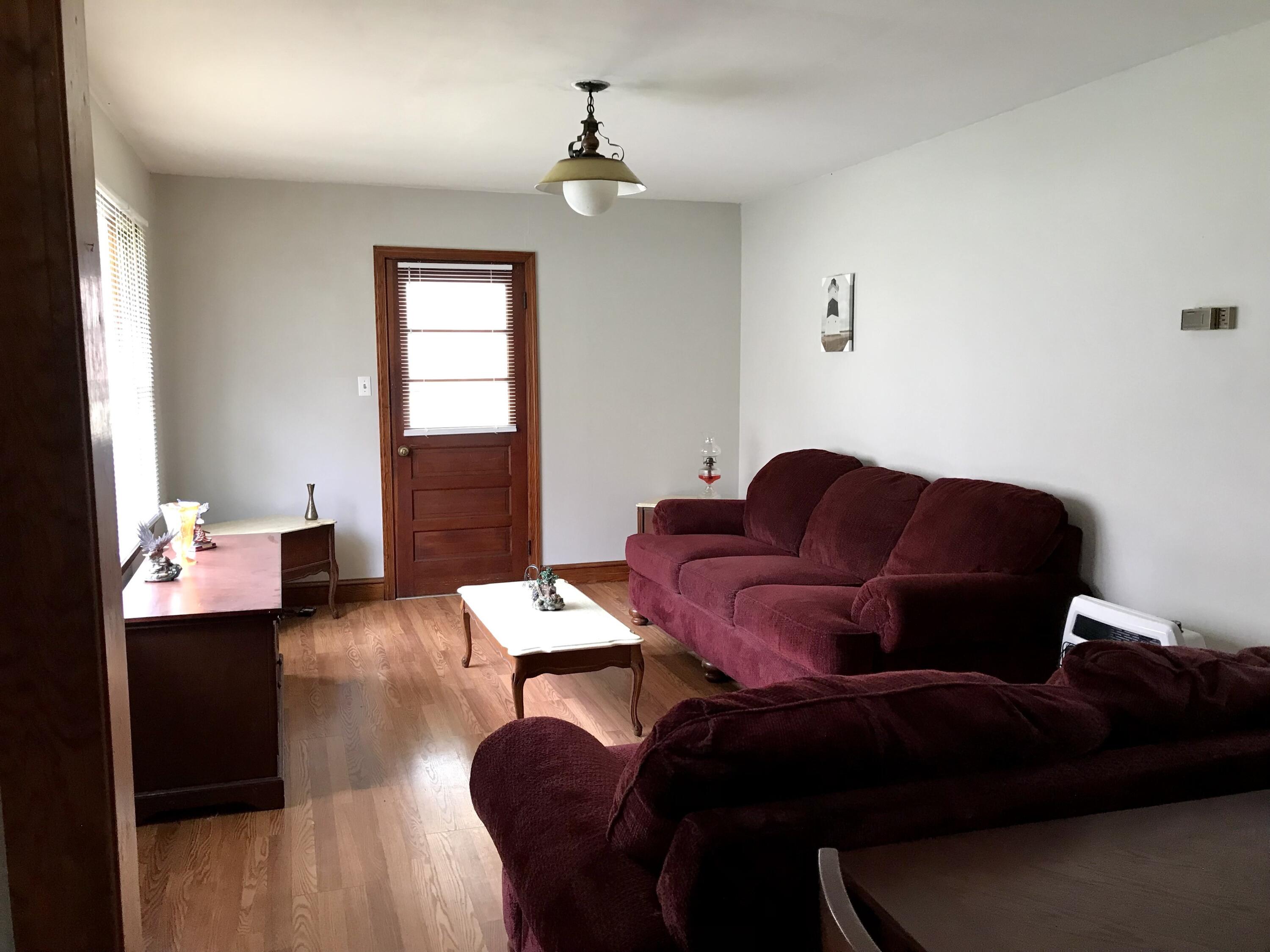8180 Chatham Road Martinsville, VA 24112 - Photo 4 of 22 a living room with furniture and wooden floor