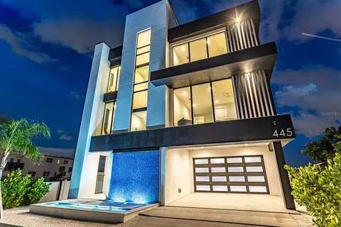 a view of front of a house with a iron gate