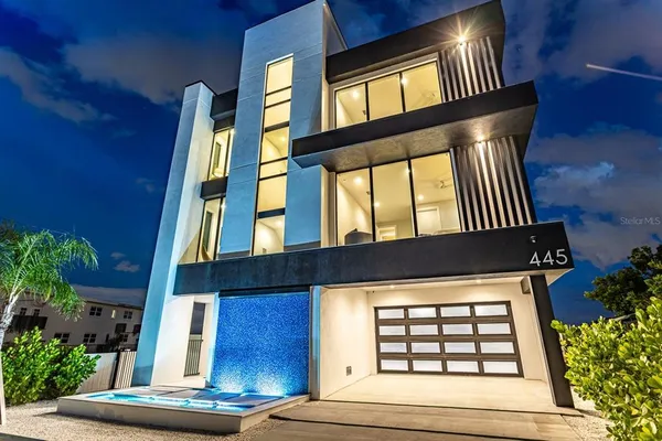 a view of front of a house with a iron gate