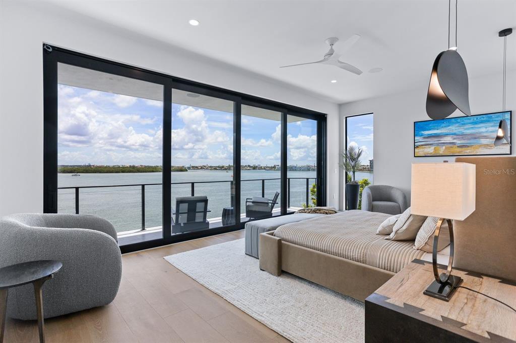 445 129th Avenue East Madeira Beach, FL 33708 - Photo 22 of 72 a bedroom with a bed and a large window