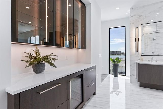 a lobby with furniture and floor to ceiling window