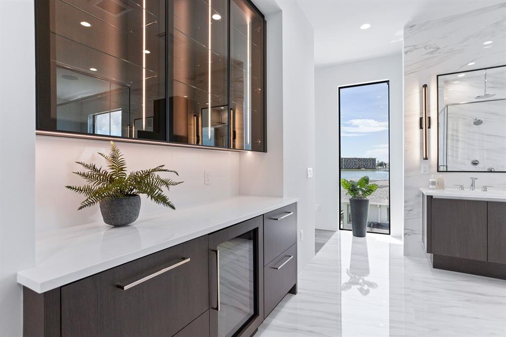 445 129th Avenue East Madeira Beach, FL 33708 - Photo 24 of 72 a kitchen with a sink and potted plant