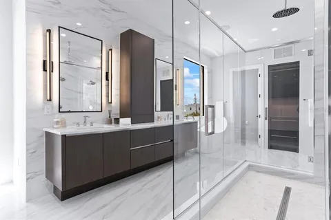 a large en suite bathroom with a tub and shower