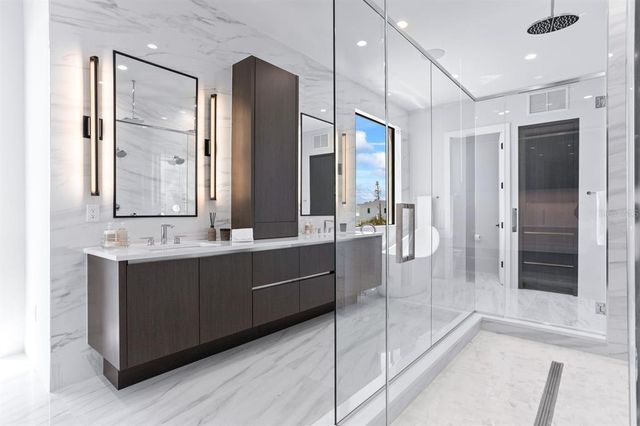 a large en suite bathroom with a tub and shower