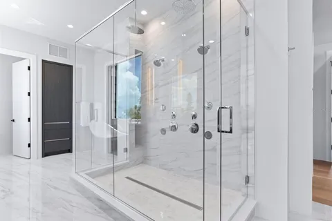 a view of a living room and kitchen with a large window