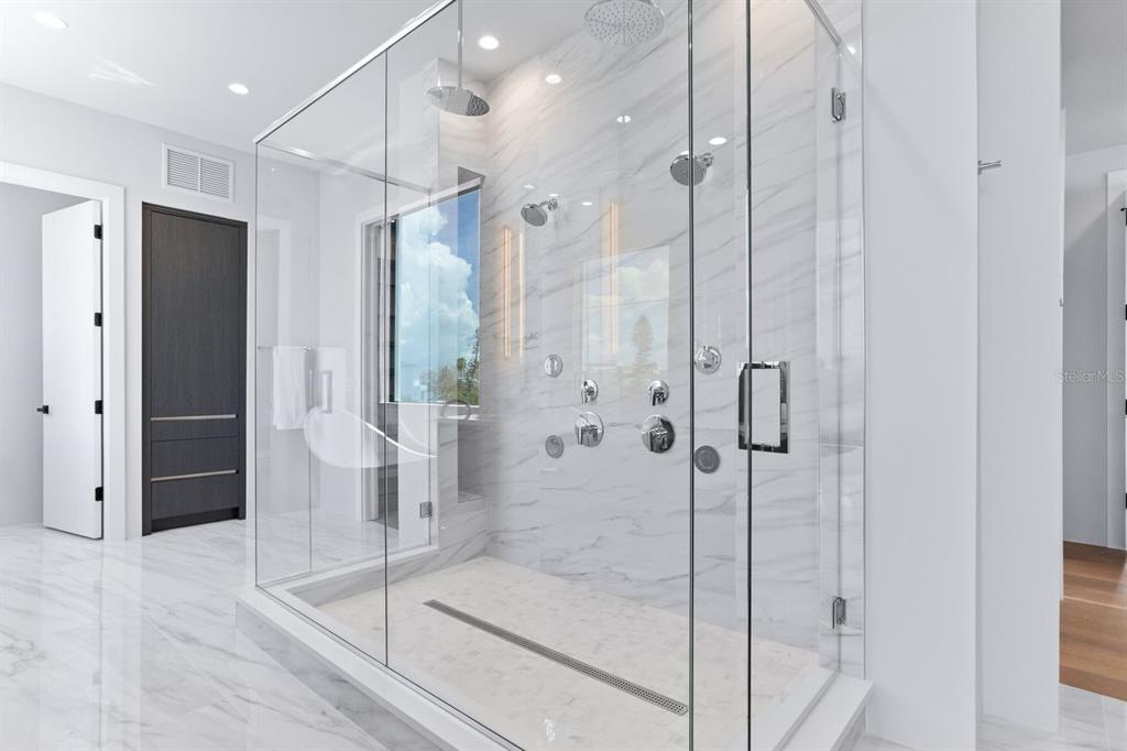 445 129th Avenue East Madeira Beach, FL 33708 - Photo 27 of 72 a bathroom with a shower and a sink