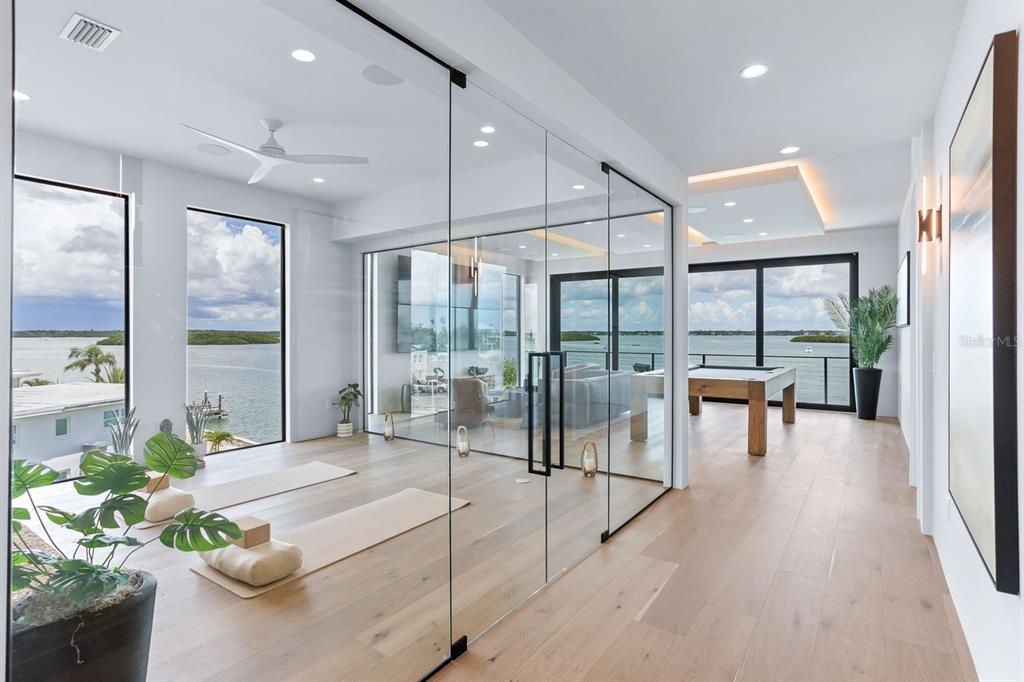 445 129th Avenue East Madeira Beach, FL 33708 - Photo 30 of 72 a lobby with furniture and floor to ceiling window