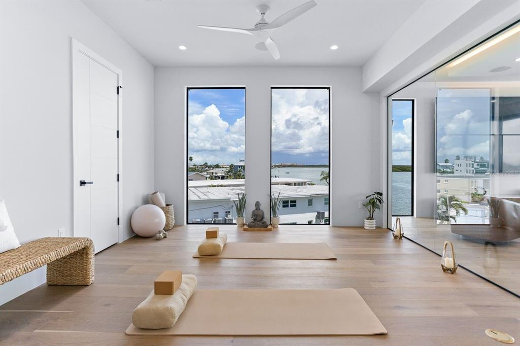 445 129th Avenue East Madeira Beach, FL 33708 - Photo 32 of 72 a living room with furniture and large windows