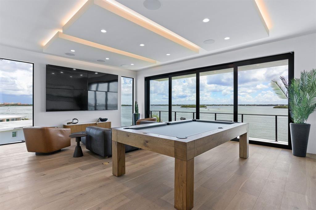 445 129th Avenue East Madeira Beach, FL 33708 - Photo 33 of 72 a view of a living room and kitchen with a large window