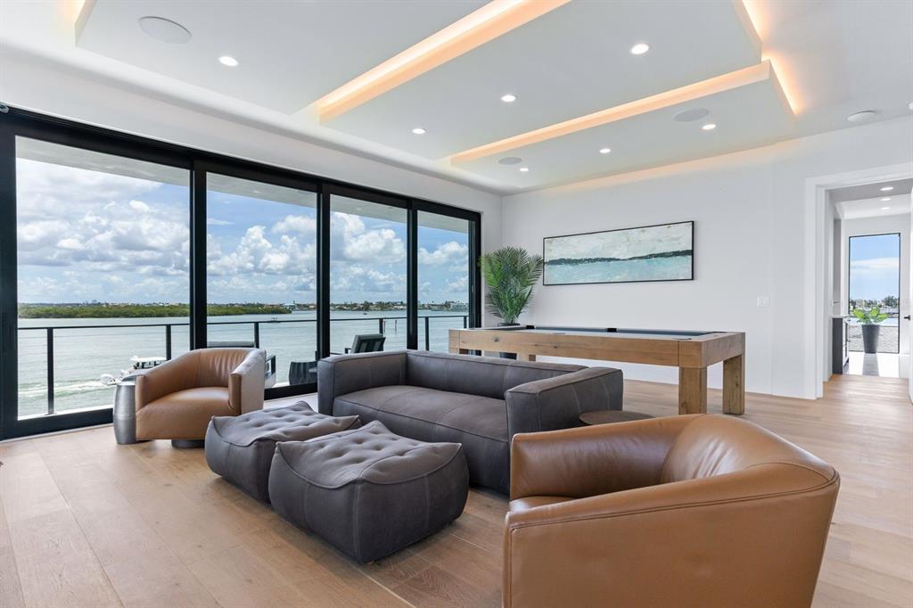 445 129th Avenue East Madeira Beach, FL 33708 - Photo 34 of 72 a living room with furniture and a large window