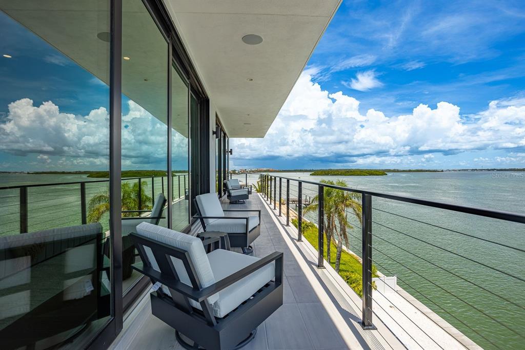 445 129th Avenue East Madeira Beach, FL 33708 - Photo 38 of 72 a view of a balcony with furniture
